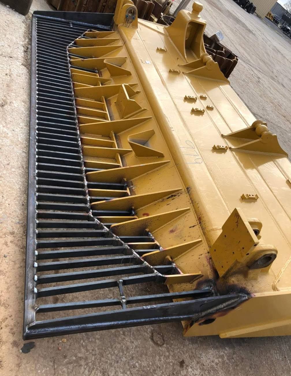 Completed root rake welded to a dozer blade